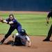 Michigan outfielder Jaclyn Crummey slides into second as a Northwestern player bobbles the ball on Sunday, May 5. Daniel Brenner I AnnArbor.com
